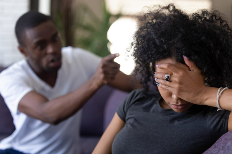 Tired african wife ignoring angry black husband blaming of problems